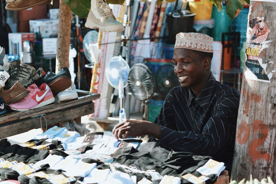 Street vendor at a lively African market, everyday commerce