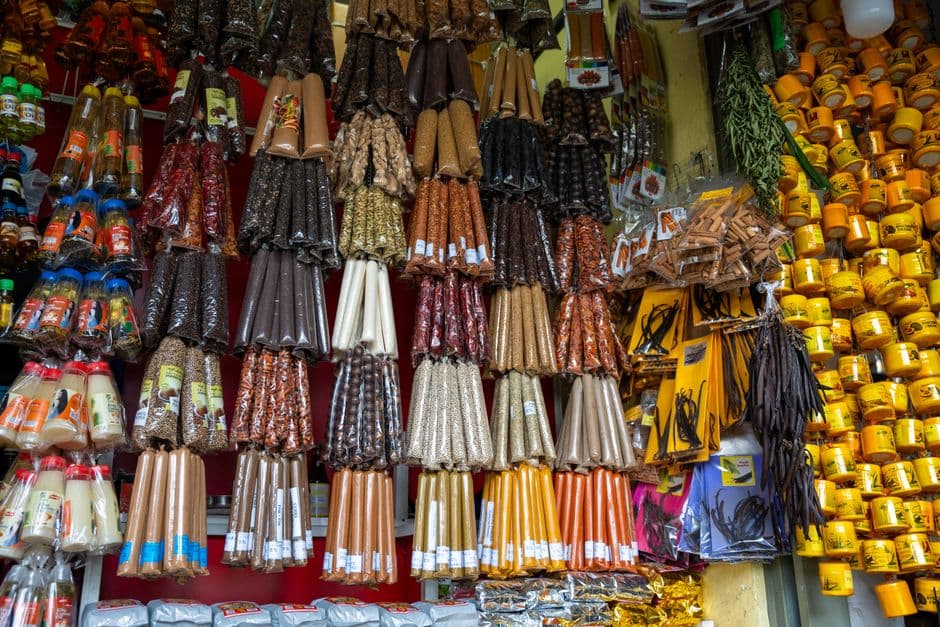 Market stall with spices, packaged goods and household items on display