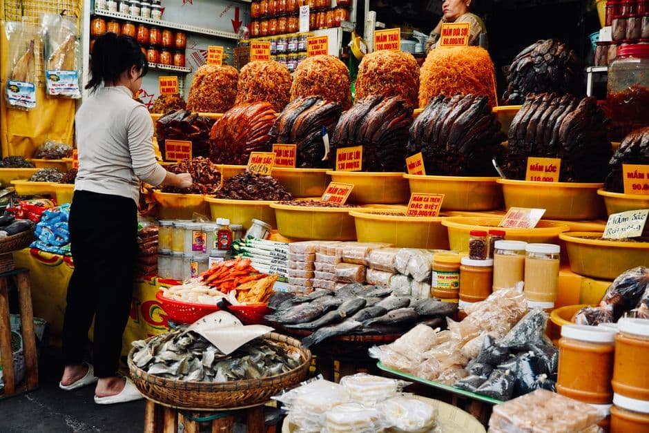 Vietnamese market stall with dried goods and spices on display