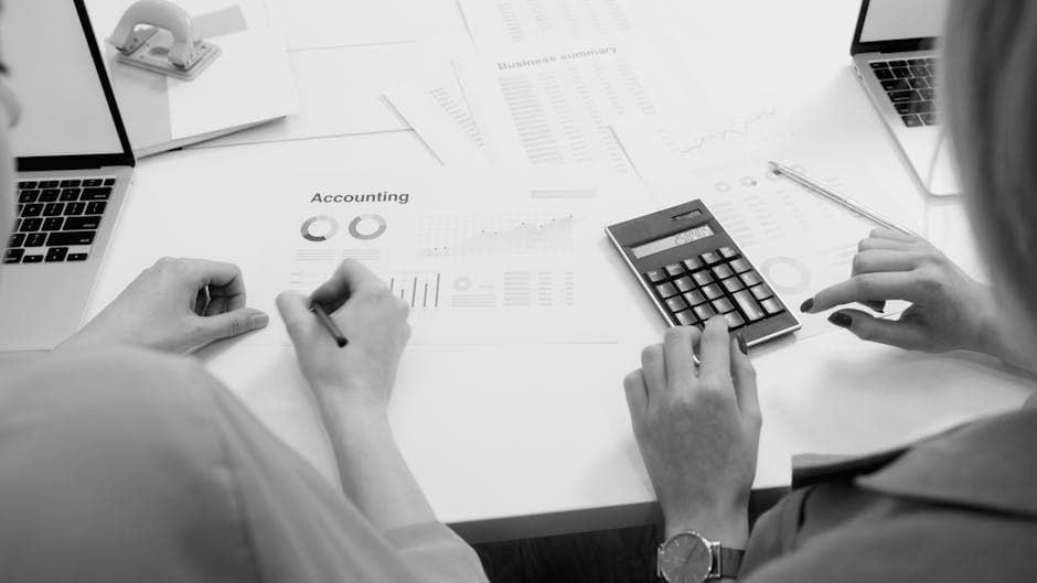 Accountant preparing tax-compliant records on a laptop