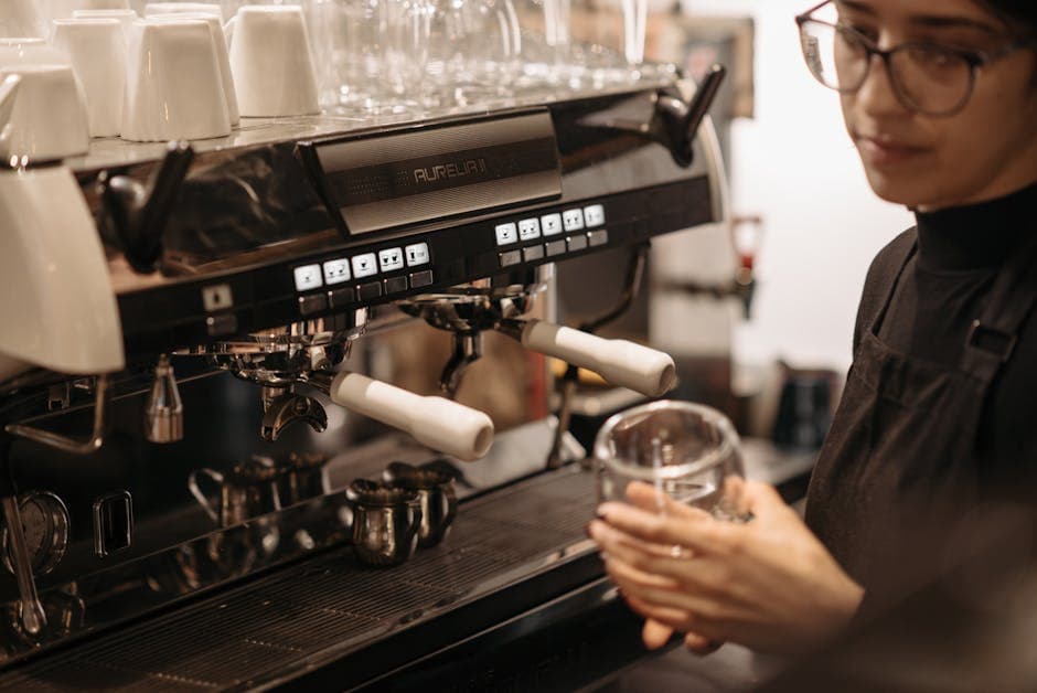 Barista preparing espresso in a modern coffee shop