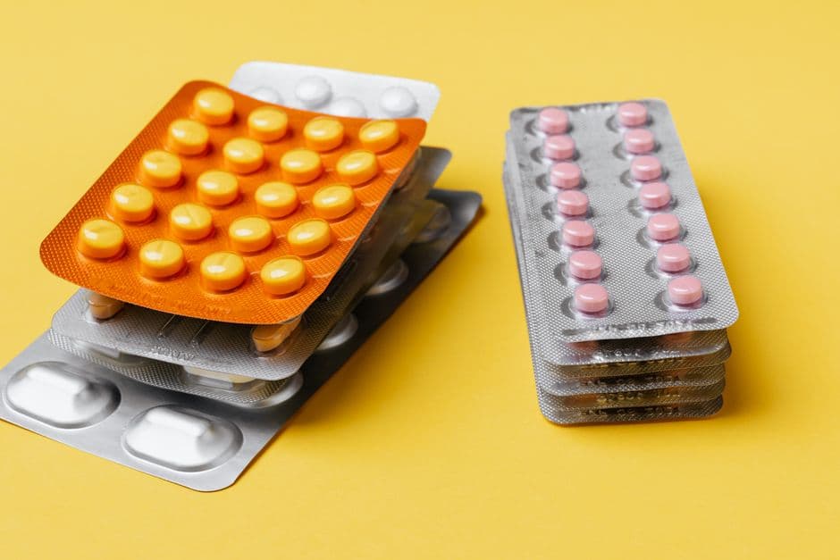 Colourful tablets and pills in blister packs in a pharmacy