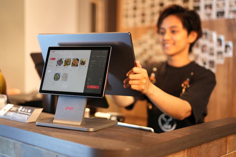 Modern restaurant POS tablet on a service counter